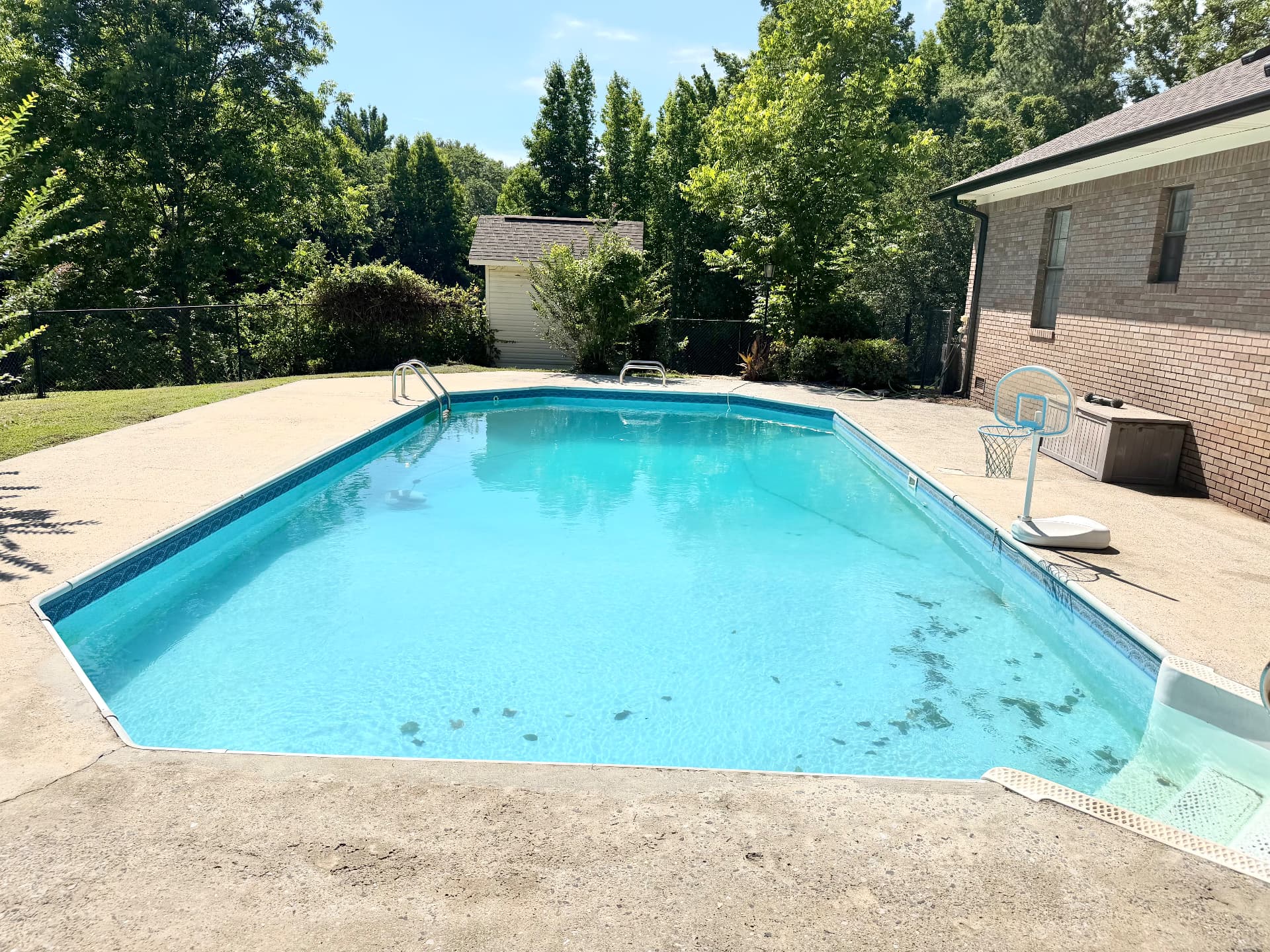 Same pool deck after pressure washing, light and clean