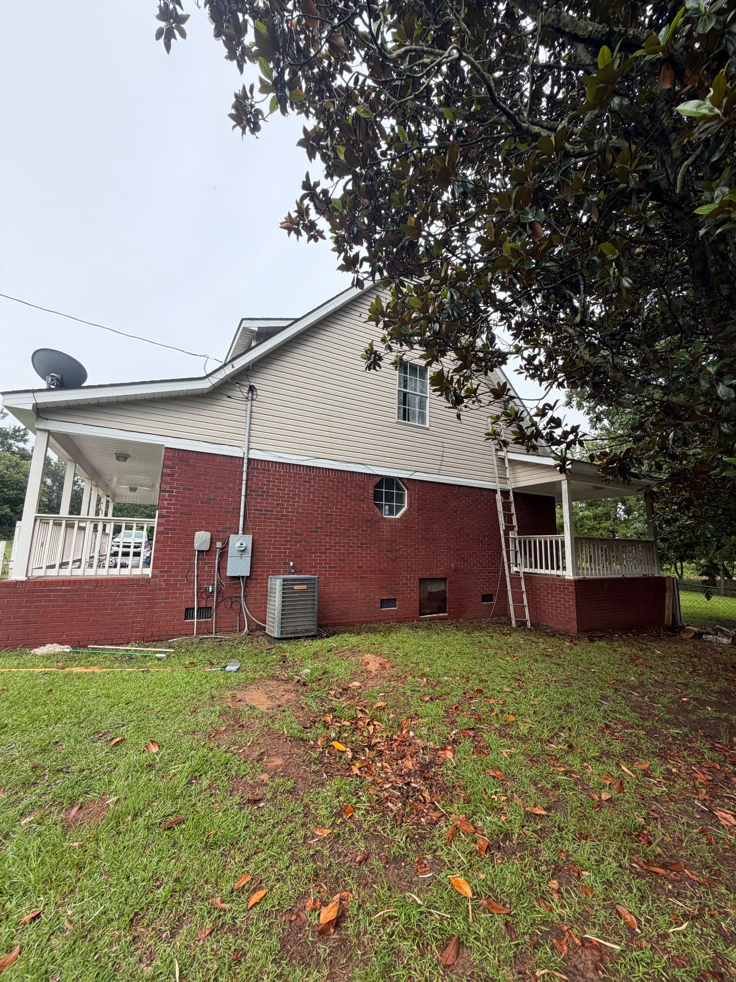 Same house siding after soft washing, clean and streak-free